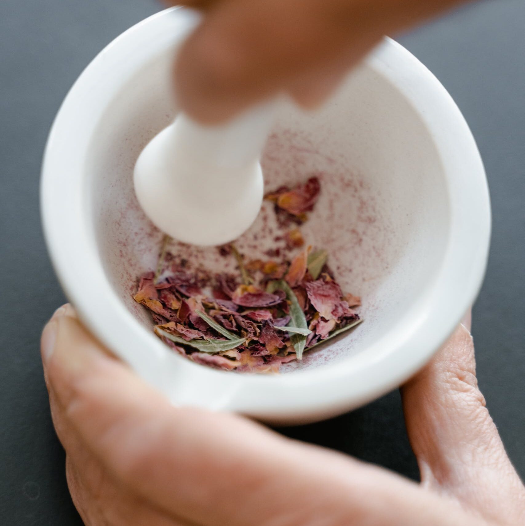 Hand Crushing the Petals Using Mortar and Pestle